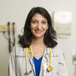 Ruchi in white coat with stethoscope